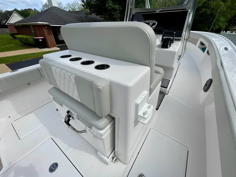 Slide: The Image of 2022 Front Runner 26 Center Console boat interior with seating and storage. - 19