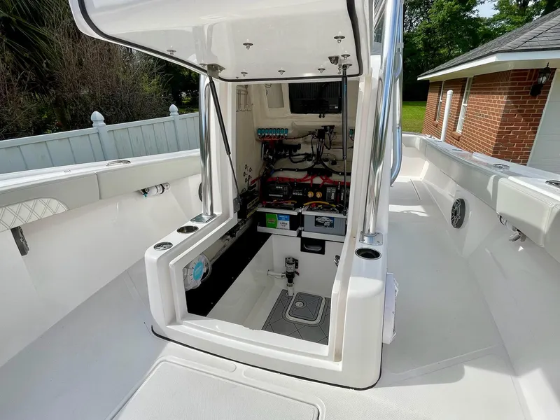Slide: The Image of 2022 Front Runner 26 Center Console boat interior with open access hatch. - 27
