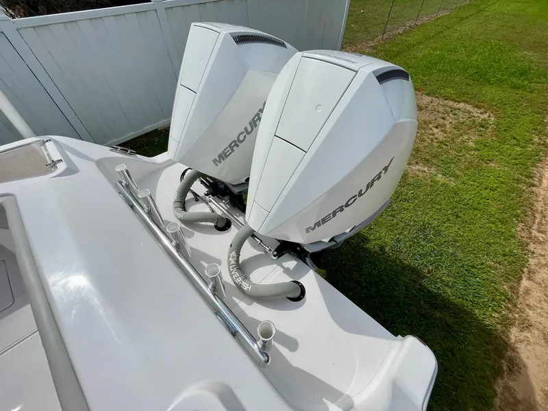Slide: The Image of Twin Mercury outboard engines on a 2022 Front Runner 26 Center Console boat. - 9