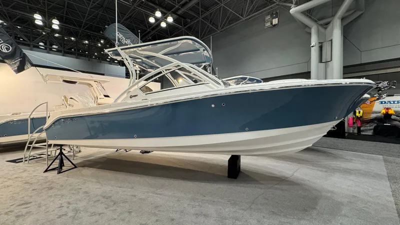 The Image of 2025 Edgewater 248 CX boat displayed indoors, showcasing sleek design and modern features. - 0