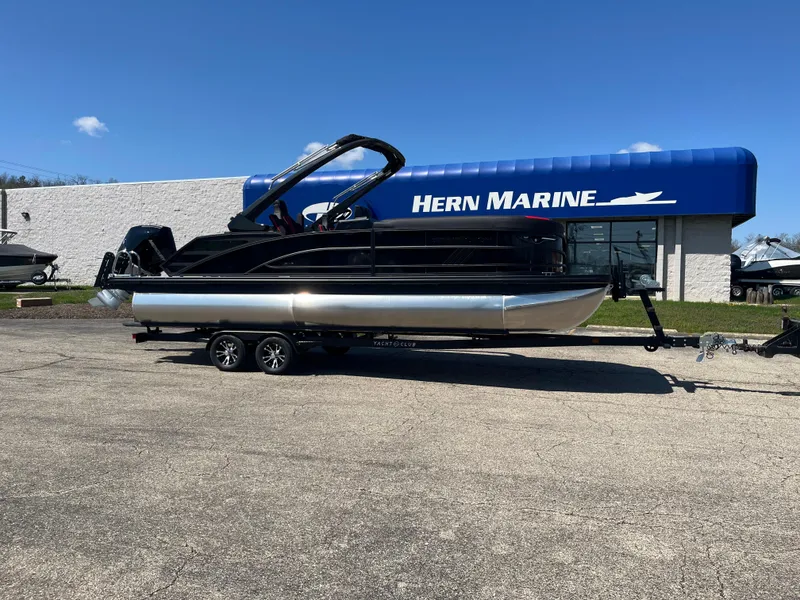 The Image of 2025 Bennington M Line boat on trailer at Hern Marine dealership. - 1