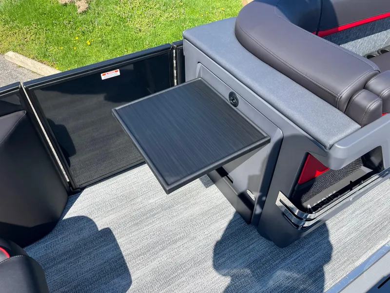 Slide: The Image of 2025 Bennington M Line boat interior with foldable table and seating. - 18