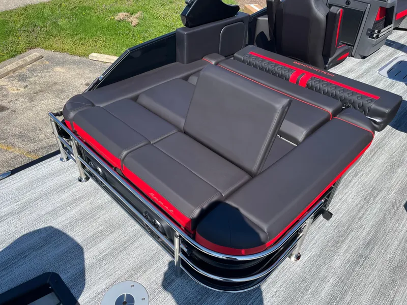 Slide: The Image of 2025 Bennington M Line boat seating with sleek black and red upholstery. - 26