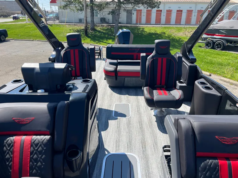 Slide: The Image of 2025 Bennington M Line boat interior with black and red seating, modern design. - 6