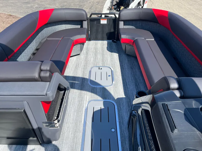 Slide: The Image of 2025 Bennington M Line boat interior with gray and red seating, modern design. - 7