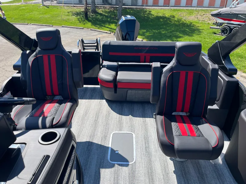 Slide: The Image of 2025 Bennington M Line boat interior with red and black seating, modern design. - 8