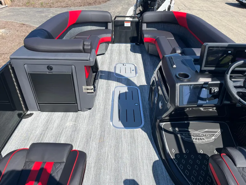 Slide: The Image of 2025 Bennington M Line boat interior with sleek seating and modern dashboard design. - 9