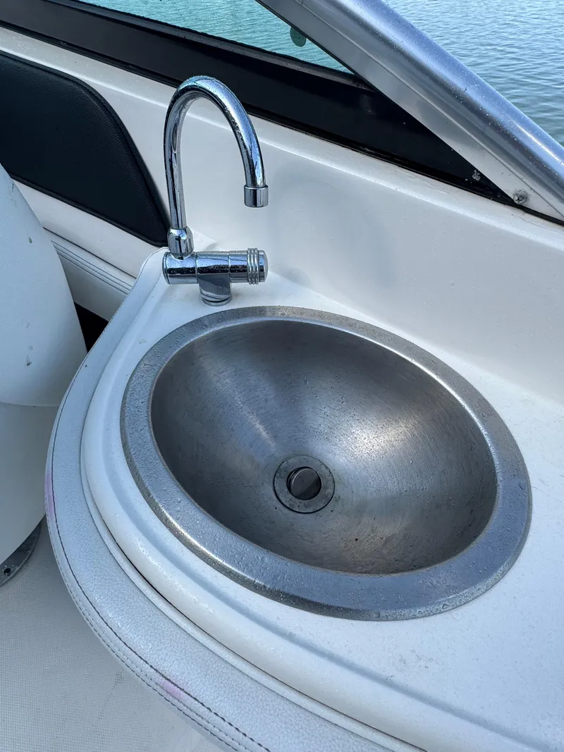 Slide: The Image of 2014 Sea Ray 260 Sundeck boat sink with chrome faucet. - 12