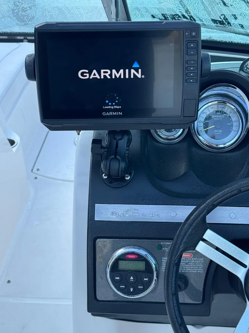 Slide: The Image of 2014 Sea Ray 260 Sundeck dashboard with Garmin navigation system. - 13