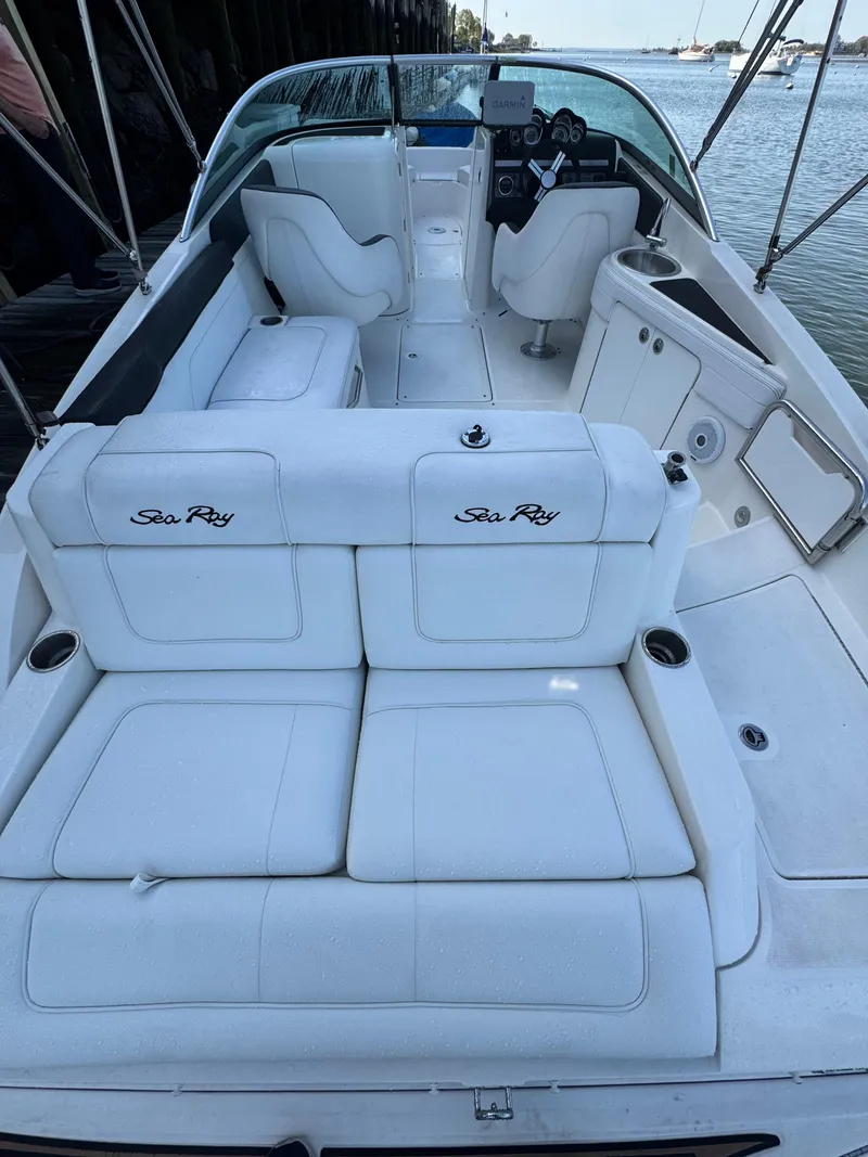 Slide: The Image of 2014 Sea Ray 260 Sundeck boat with white seating and spacious deck. - 15