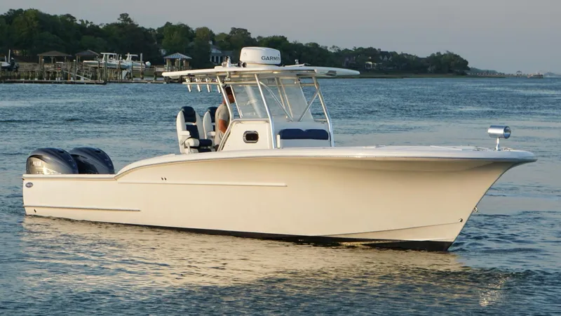 Slide: The Image of 2013 Buddy Davis 34 Center Console boat on calm water. - 12