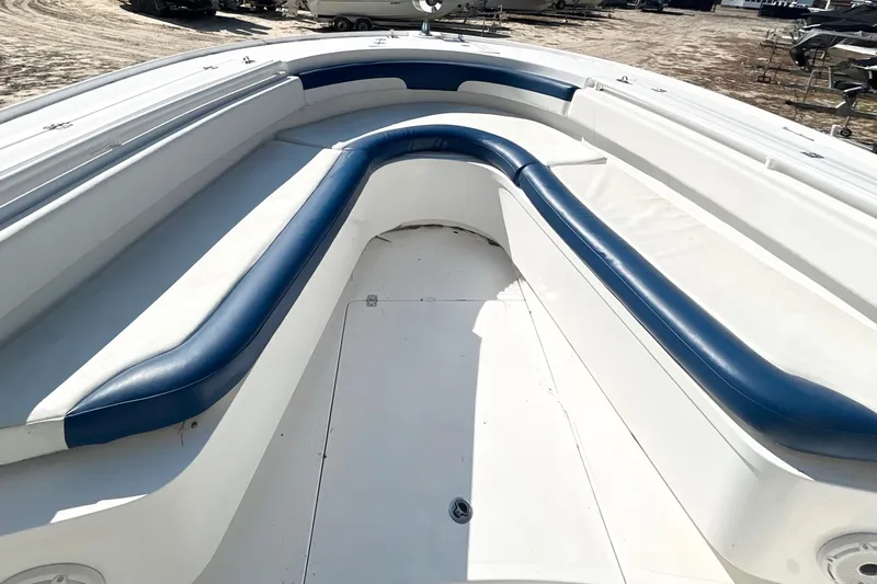 Slide: The Image of 2013 Buddy Davis 34 Center Console boat with blue and white seating. - 21