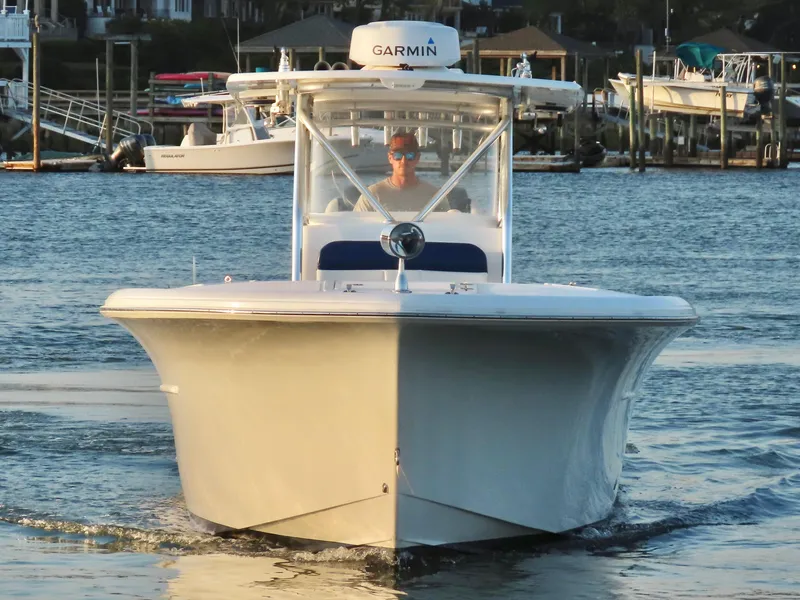 Slide: The Image of 2013 Buddy Davis 34 Center Console boat on water, front view, with Garmin equipment. - 6