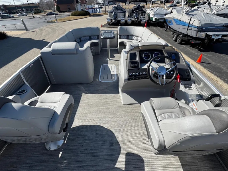 Slide: The Image of 2020 Bennington Q 25 QSR pontoon boat interior with plush seating and modern dashboard. - 20