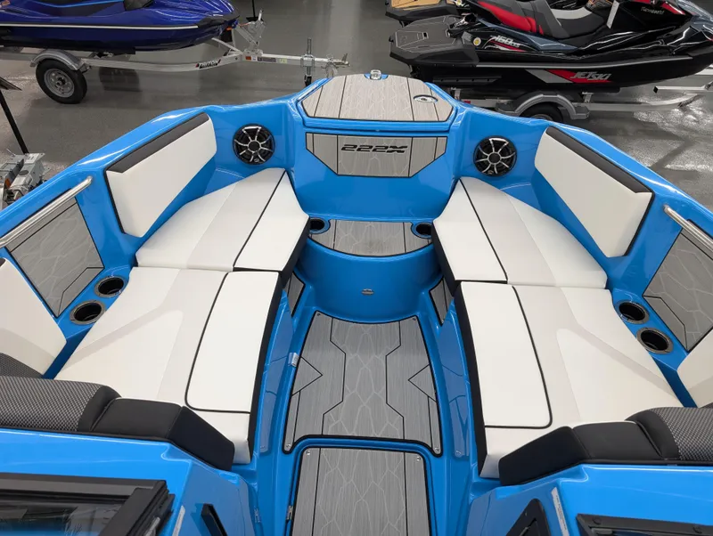 Slide: The Image of 2023 Yamaha Boats 222XD interior with blue and white seating, showcasing modern design. - 10