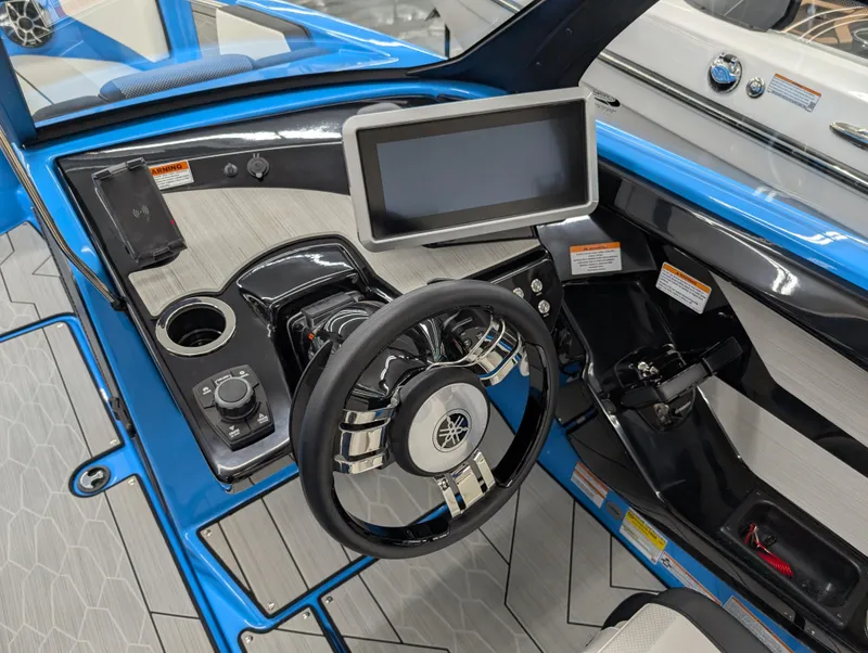 Slide: The Image of 2023 Yamaha Boats 222XD dashboard with steering wheel and touchscreen display. - 4