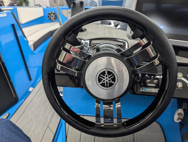 Slide: The Image of Steering wheel of 2023 Yamaha Boats 222XD, featuring sleek design and modern dashboard. - 5