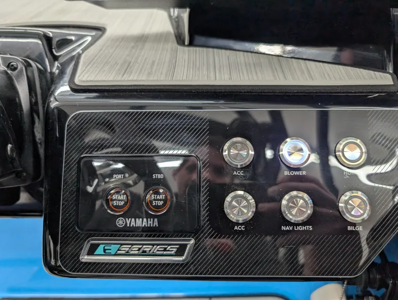 Slide: The Image of Control panel of 2023 Yamaha Boats 222XD with start buttons and accessory switches. - 8