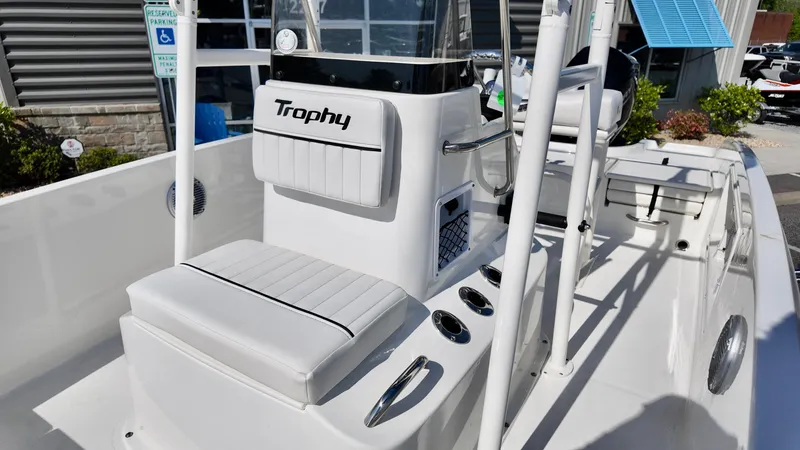 Slide: The Image of 2025 Bayliner T18 Limited Edition boat interior with white seating and console. - 12