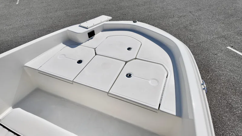 Slide: The Image of 2025 Bayliner T18 Limited Edition boat deck with storage compartments. - 13