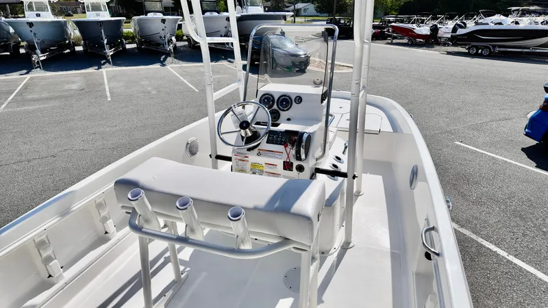 Slide: The Image of 2025 Bayliner T18 Limited Edition boat interior with steering console and seating. - 14
