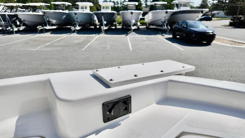 Slide: The Image of 2025 Bayliner T18 Limited Edition boat detail with parking lot and boats in background. - 3
