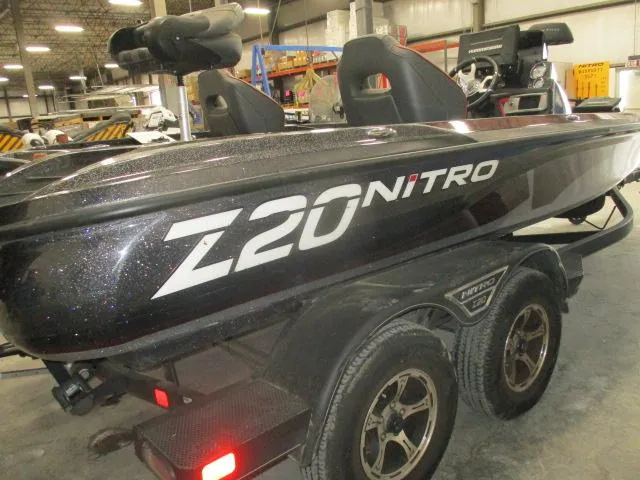 Slide: The Image of 2023 Nitro Z20 boat on trailer in a warehouse setting. - 0