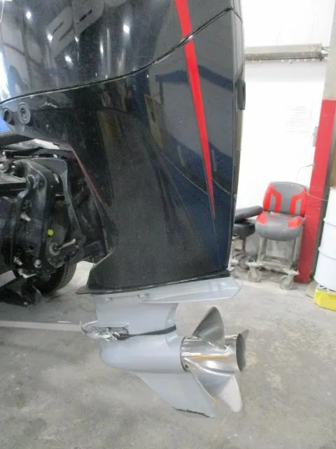 Slide: The Image of 2023 Nitro Z20 boat engine with propeller in a workshop setting. - 11