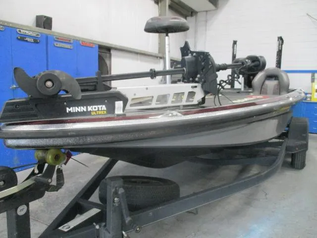 Slide: The Image of 2023 Nitro Z20 fishing boat with Minn Kota Ultrex motor in a garage setting. - 15