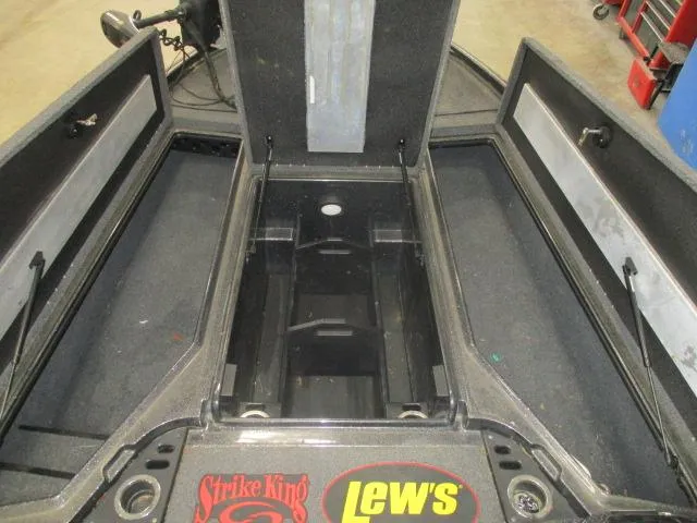 Slide: The Image of 2023 Nitro Z20 boat interior with open storage compartments and fishing gear logos. - 4