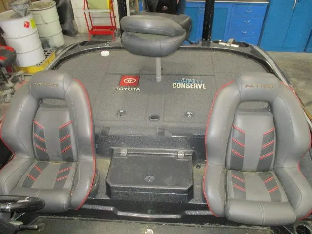 Slide: The Image of 2023 Nitro Z20 boat interior with gray seats and Toyota branding. - 5