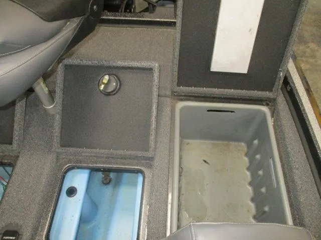 Slide: The Image of 2023 Nitro Z20 boat interior storage compartments and seating area. - 8