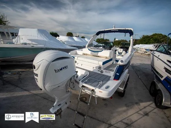 Slide: The Image of 2024 Chaparral 270 OSX boat with Yamaha engine, docked outdoors. - 14