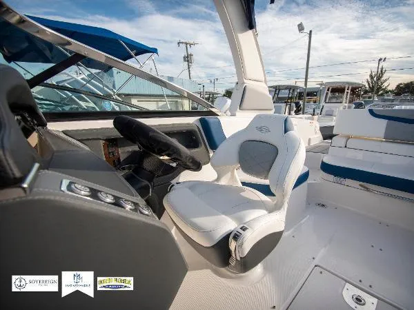Slide: The Image of 2024 Chaparral 270 OSX boat interior with modern helm and seating. - 18