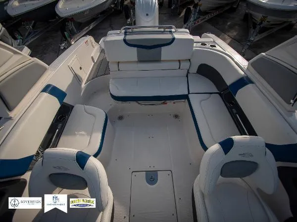 Slide: The Image of 2024 Chaparral 270 OSX boat interior with white and blue seating arrangement. - 20