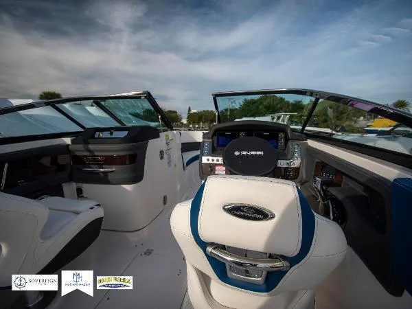 Slide: The Image of 2024 Chaparral 270 OSX boat cockpit with modern dashboard and steering wheel. - 23