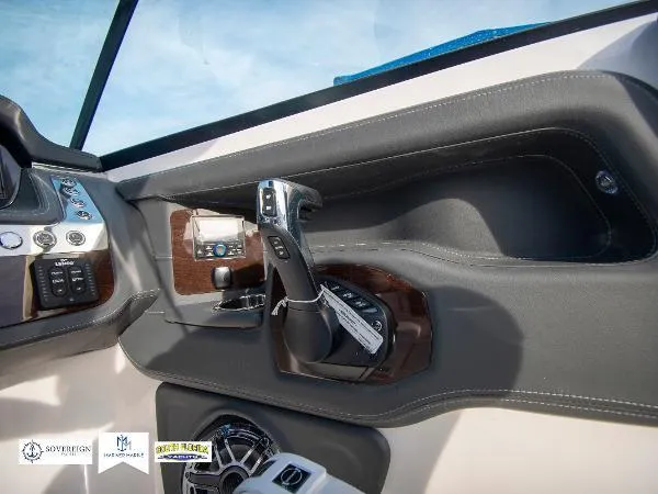 Slide: The Image of 2024 Chaparral 270 OSX boat cockpit with modern controls and sleek design. - 30