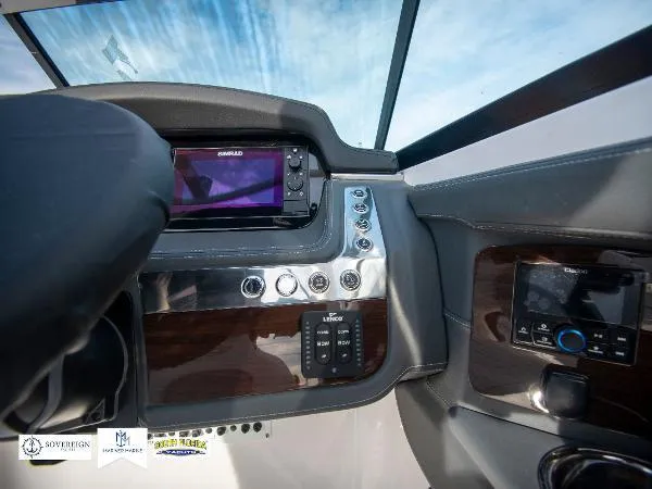 Slide: The Image of 2024 Chaparral 270 OSX dashboard with modern controls and navigation system. - 32