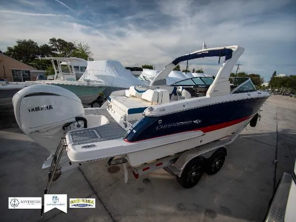 Slide: The Image of 2024 Chaparral 270 OSX boat with Yamaha engine, parked on a trailer. - 4