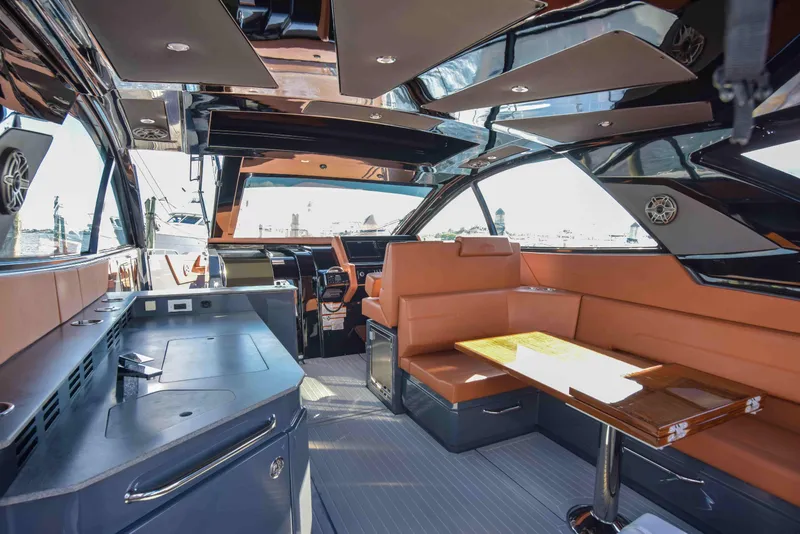 Slide: The Image of Interior of 2021 Cruisers Yachts 42 GLS OB, featuring luxurious seating and modern amenities. - 11