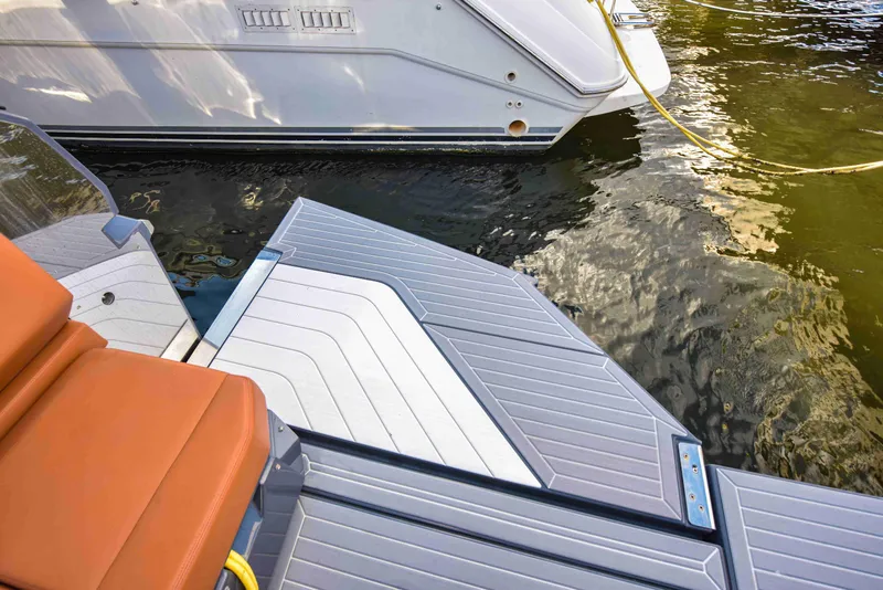 Slide: The Image of 2021 Cruisers Yachts 42 GLS OB swim platform with water reflection. - 21