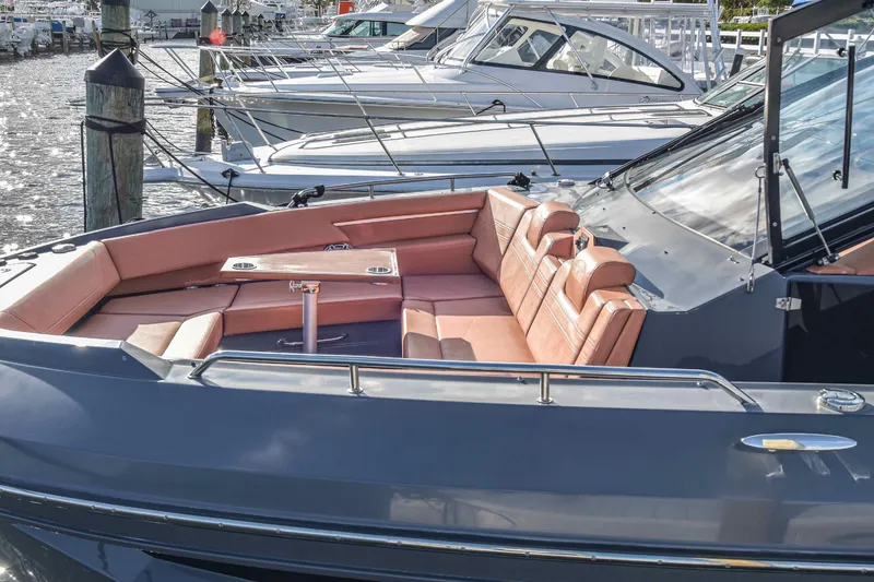 Slide: The Image of 2021 Cruisers Yachts 42 GLS OB with spacious seating at a marina. - 24
