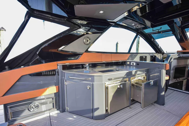 Slide: The Image of 2021 Cruisers Yachts 42 GLS OB interior with sleek kitchen and modern design elements. - 26