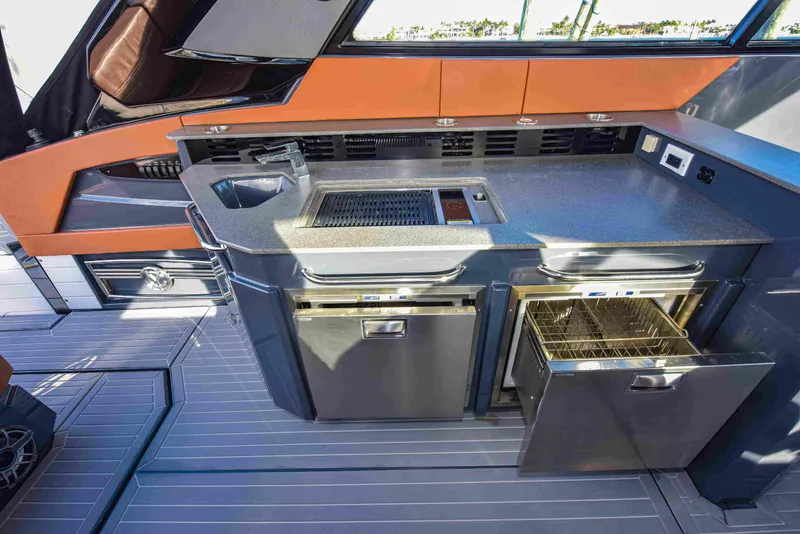 Slide: The Image of Modern kitchen area on 2021 Cruisers Yachts 42 GLS OB with appliances and sleek design. - 27