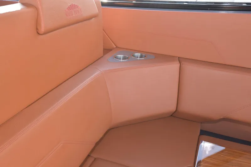 Slide: The Image of Luxurious tan leather seating with cup holders on 2021 Cruisers Yachts 42 GLS OB. - 28