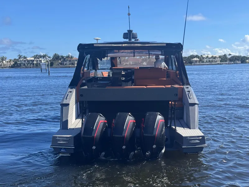 Slide: The Image of 2021 Cruisers Yachts 42 GLS OB with triple outboard engines on the water. - 3