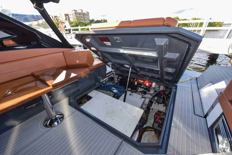 Slide: The Image of 2021 Cruisers Yachts 42 GLS OB engine compartment with open hatch, dockside view. - 32
