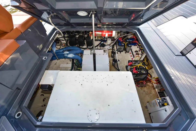 Slide: The Image of Engine compartment of 2021 Cruisers Yachts 42 GLS OB, showcasing mechanical components and wiring. - 33