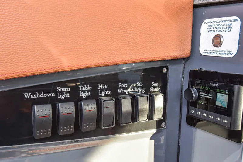 Slide: The Image of Control panel of 2021 Cruisers Yachts 42 GLS OB with labeled switches and audio system. - 37