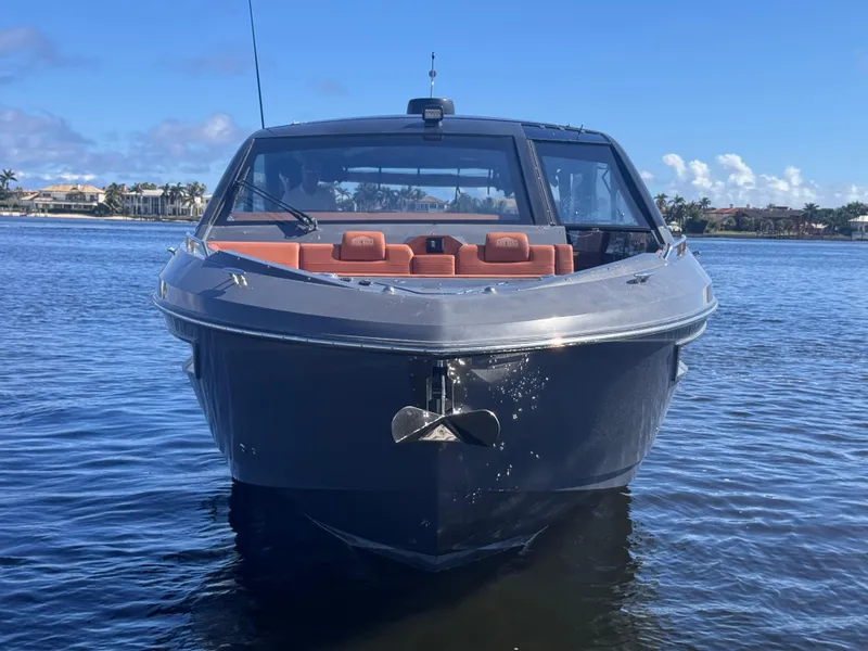 Slide: The Image of 2021 Cruisers Yachts 42 GLS OB on water, front view, clear sky background. - 4